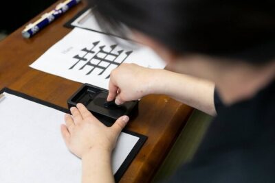 Learning Zen of Japanese Calligraphy in kimono near Osaka Castle