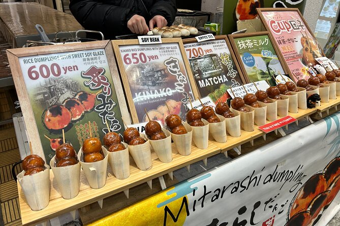 Osaka Delights: Traditional Japanese Food Tour - An egg tart before the neon