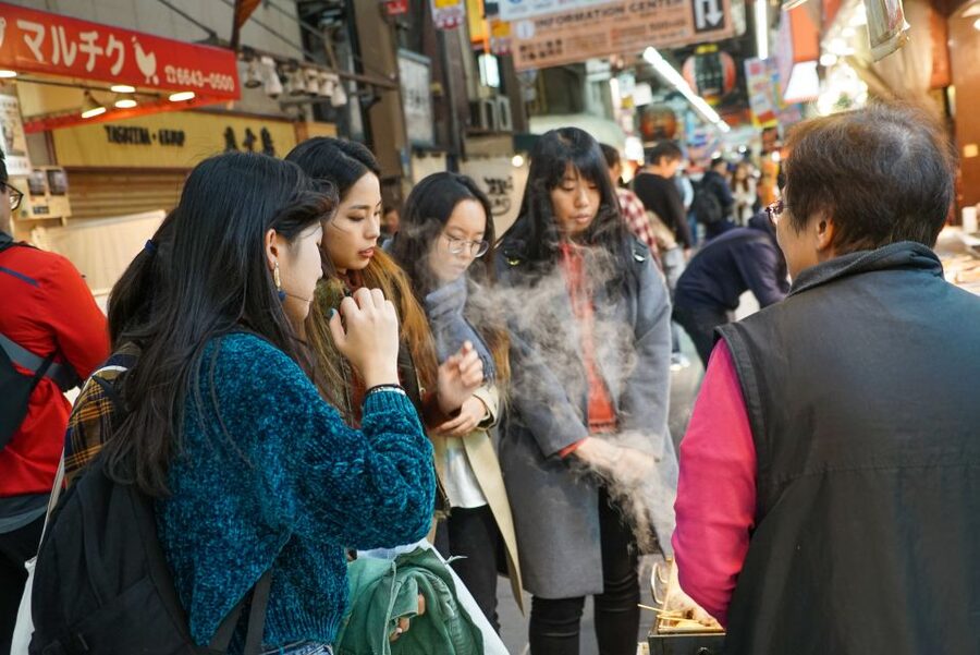 Osaka: Kuromon Market Food Walking Tour (6 stops, 6 tastes) - A restaurant stop and a slower lane