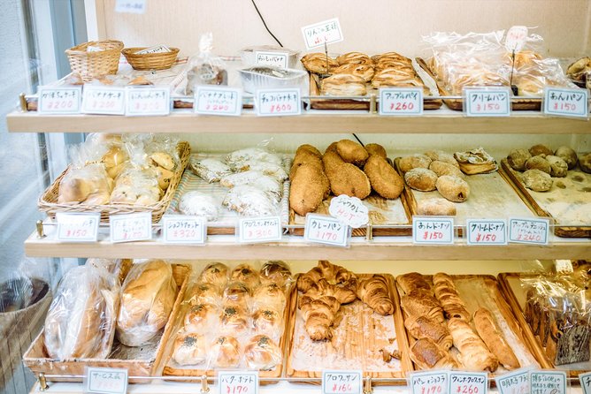 Osaka Private Food Tours by Local Foodies: 100% Personalized - A retro finish near Tsutenkaku