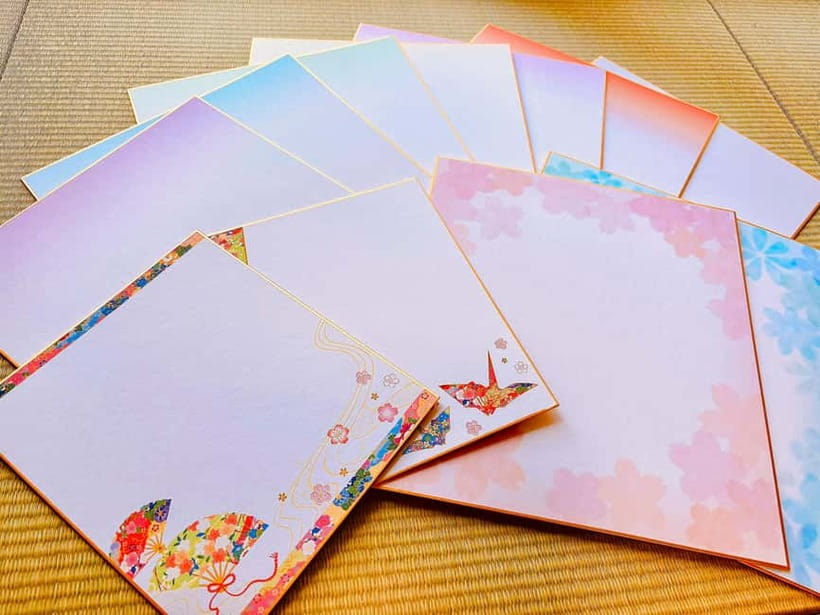 Osaka: Private Japanese Calligraphy Experience - Making the final piece on colored paper
